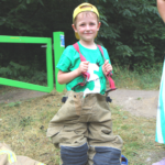 Photo of a small boy in fire fighting suit!