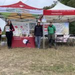 Team photo next two gazebos displaying Thames Basin Heaths Partnership messaging.