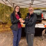Two Thames Basin Heaths staff members holding slow worms.